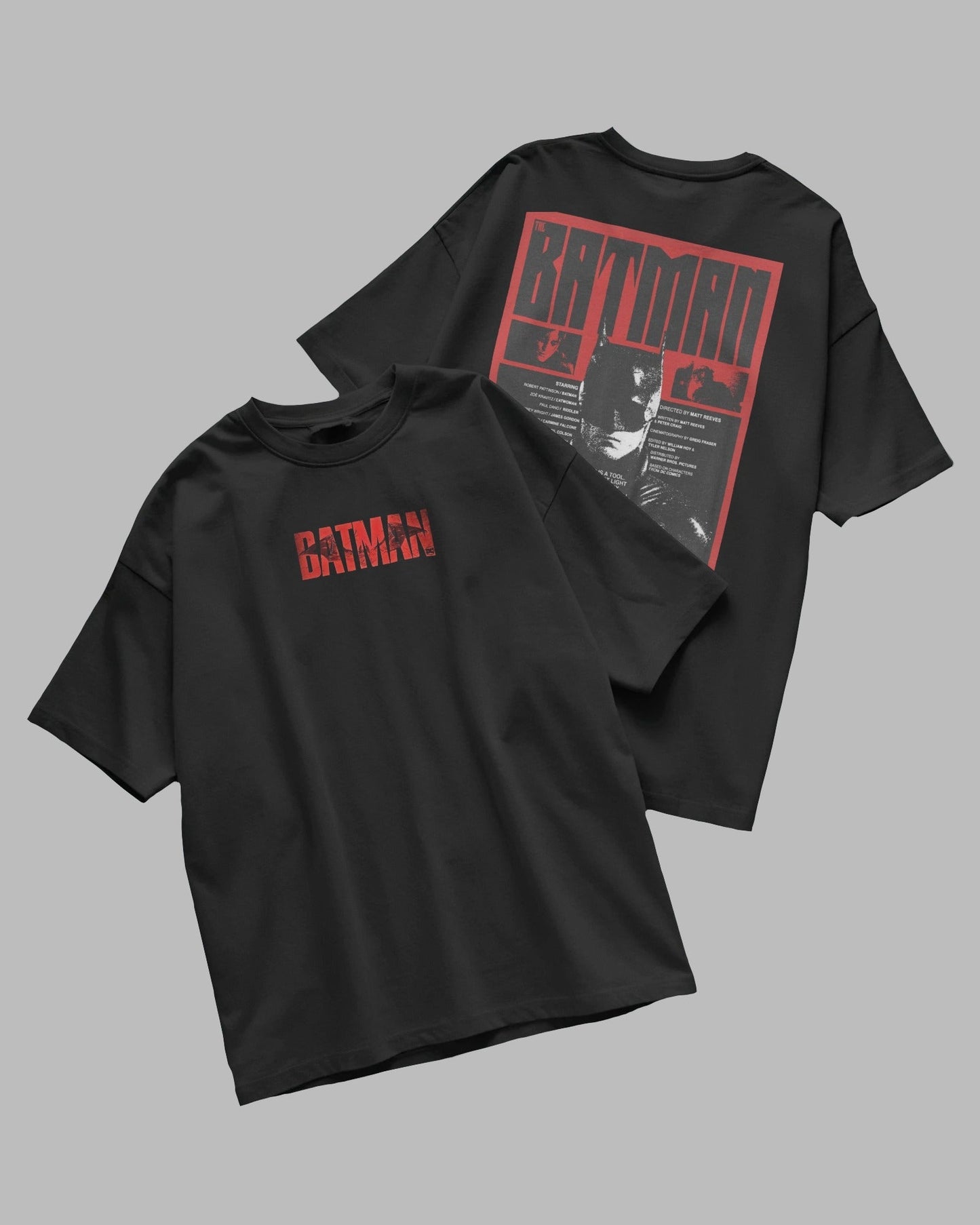Black t-shirt with red 'Batman' logo on a gray background