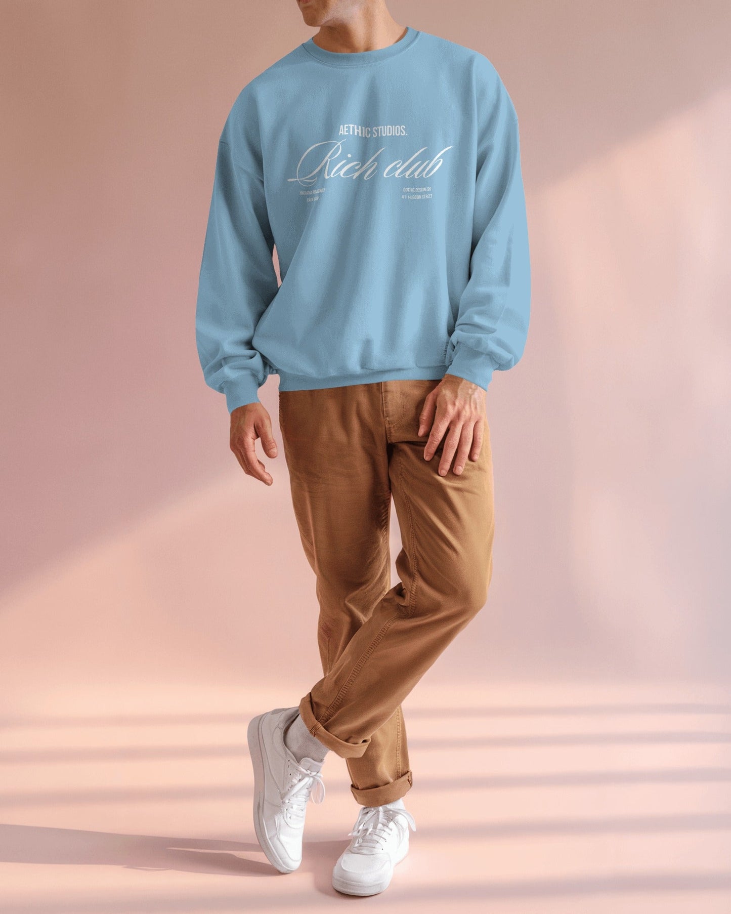 Front view of oversized sweatshirt with Rich Club text design and relaxed fit blue
