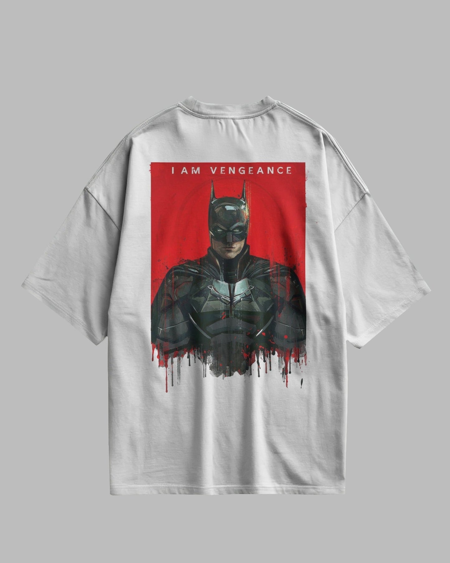 White t-shirt with a graphic of a character in a dark suit on a red background, with text 'I AM VENGEANCE'.