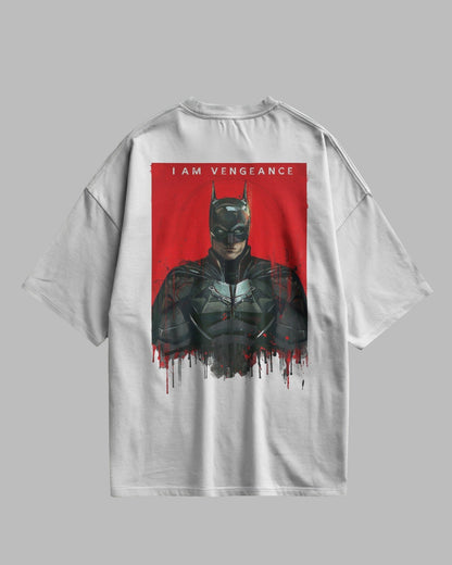 White t-shirt with a graphic of a character in a dark suit on a red background, with text 'I AM VENGEANCE'.
