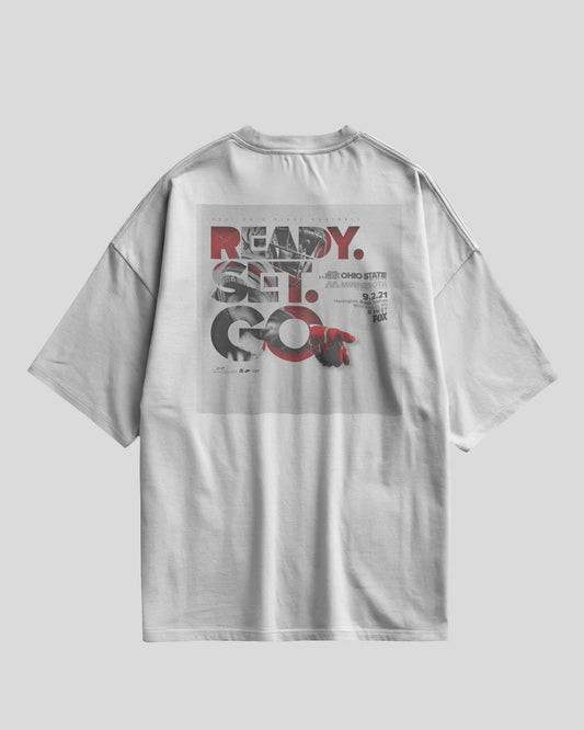 White oversized t-shirt with Ready Set Go graphic design on the back and Aethic Studios text on the front
