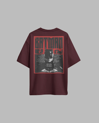Maroon t-shirt with Batman graphic on the back against a gray background