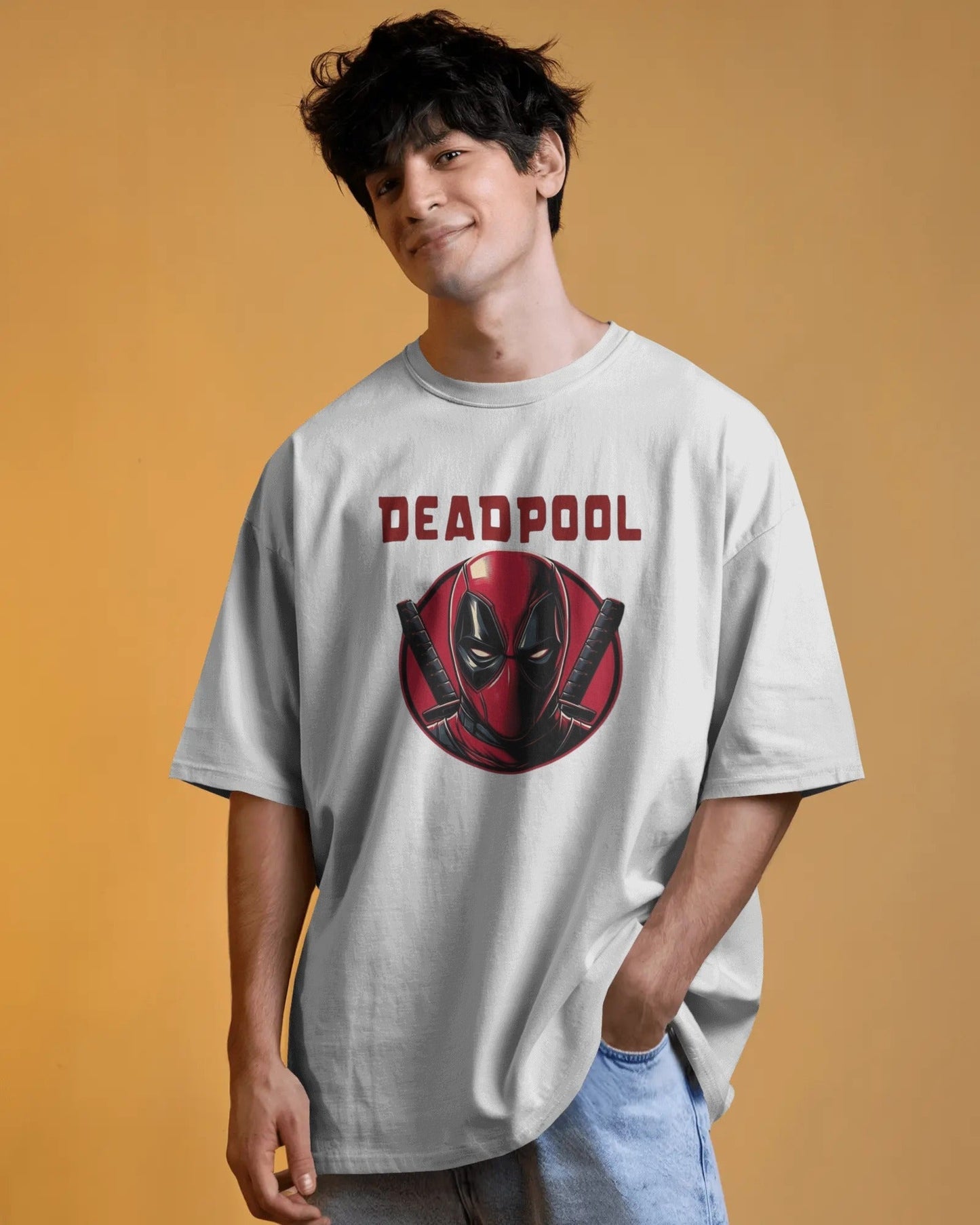 Person wearing a Deadpool t-shirt against an orange background