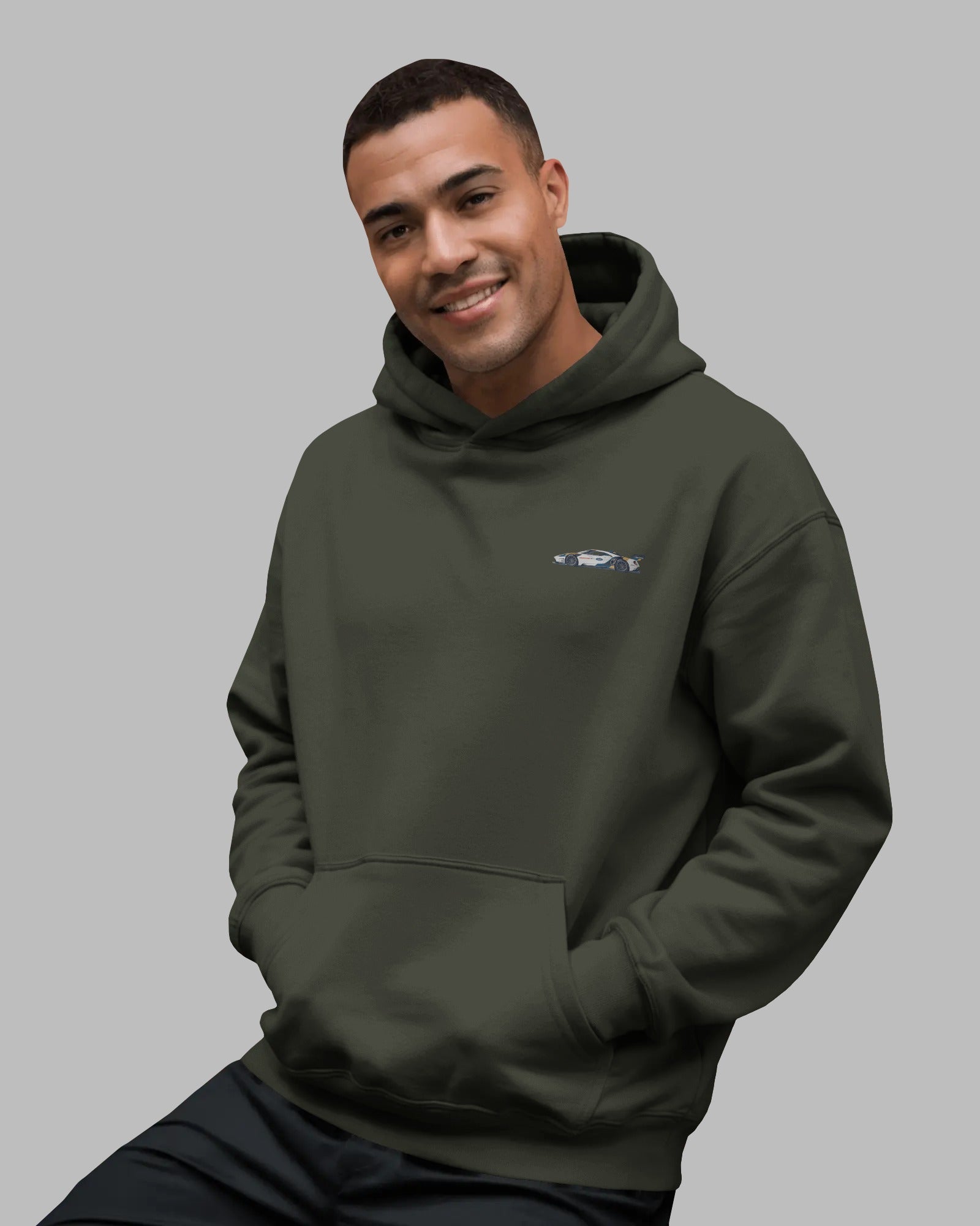 male model wearing army green Ford GT hoodie – side view with graphic print – Aethic Apparels