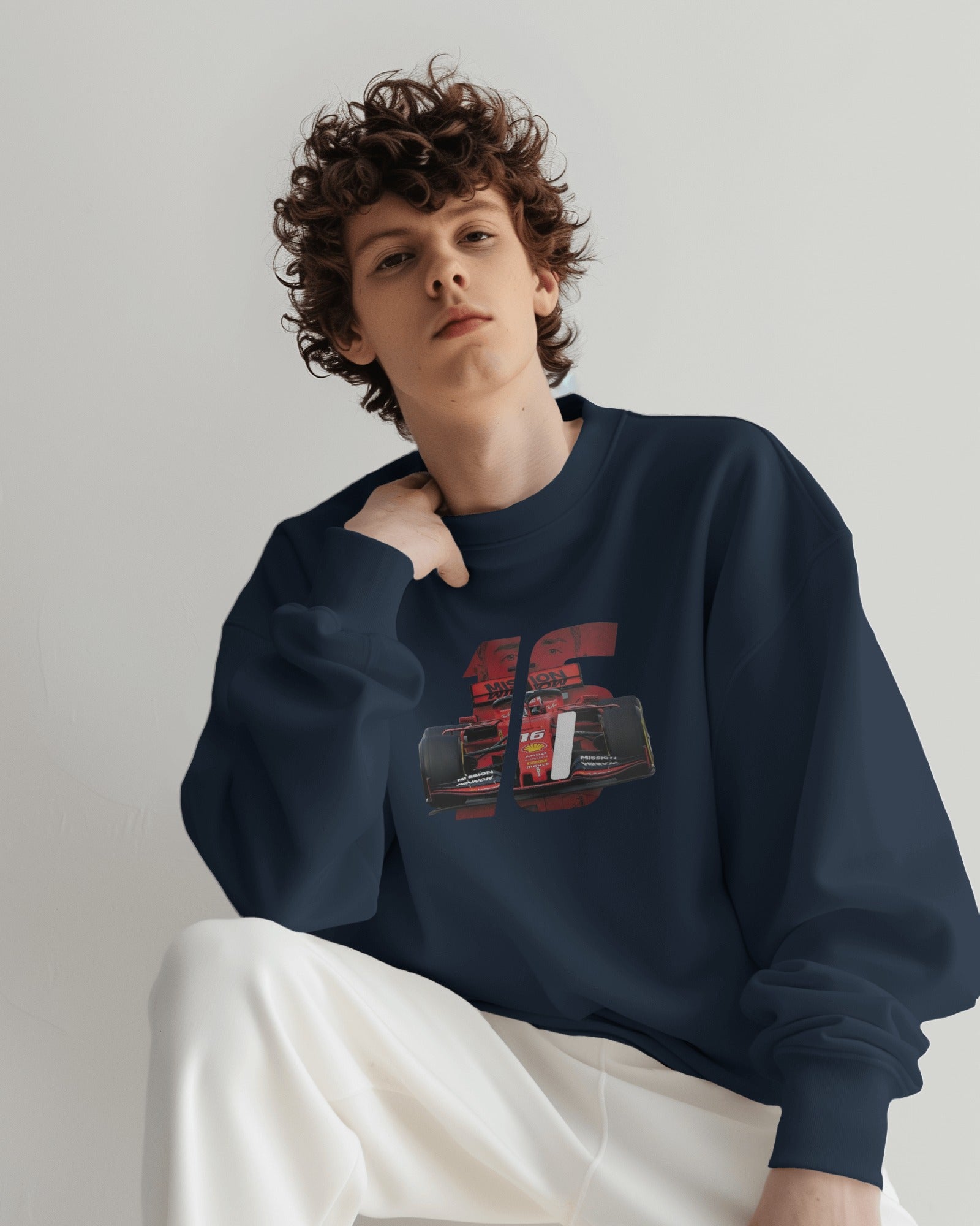 male model wearing navy racing graphic sweatshirt with bold F1 car design – Aethic Apparels streetwear