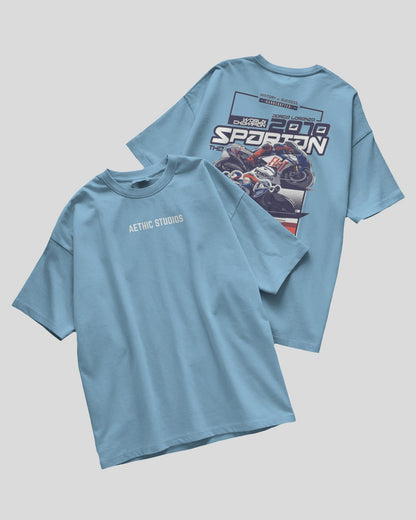 Light blue t-shirt with graphic design on a gray background