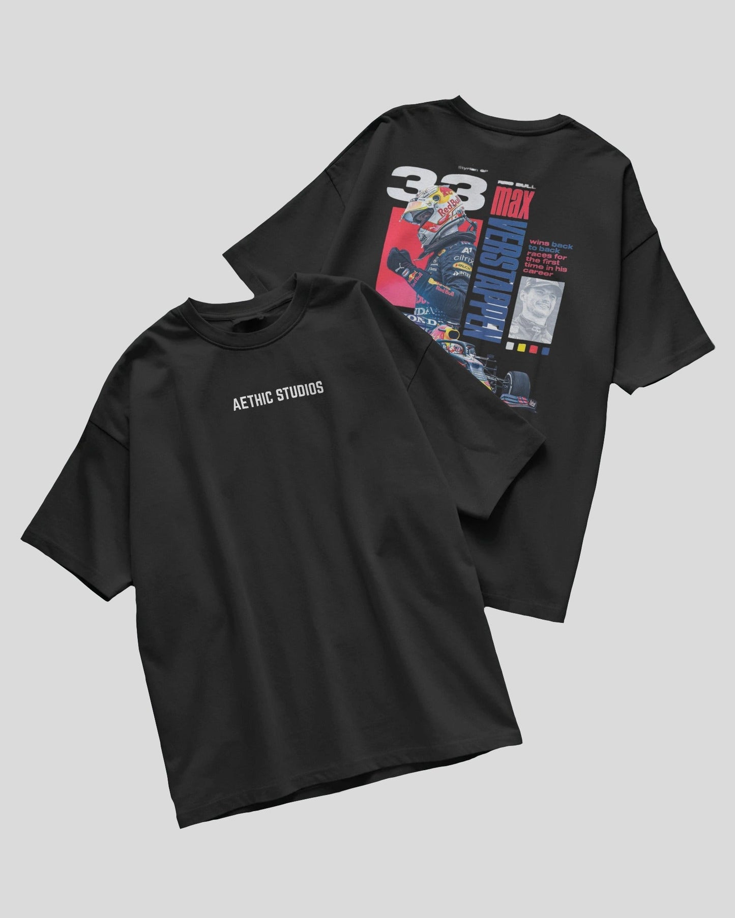 Two black t-shirts with graphic designs on a gray background