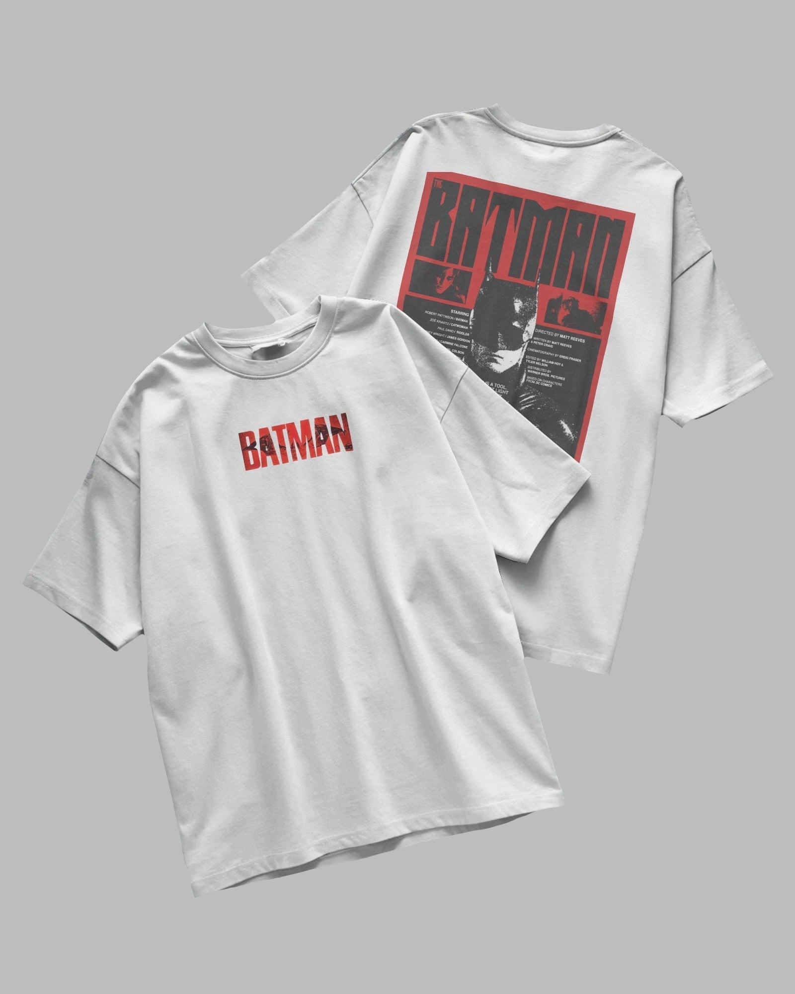 White t-shirt with Batman logo on a gray background