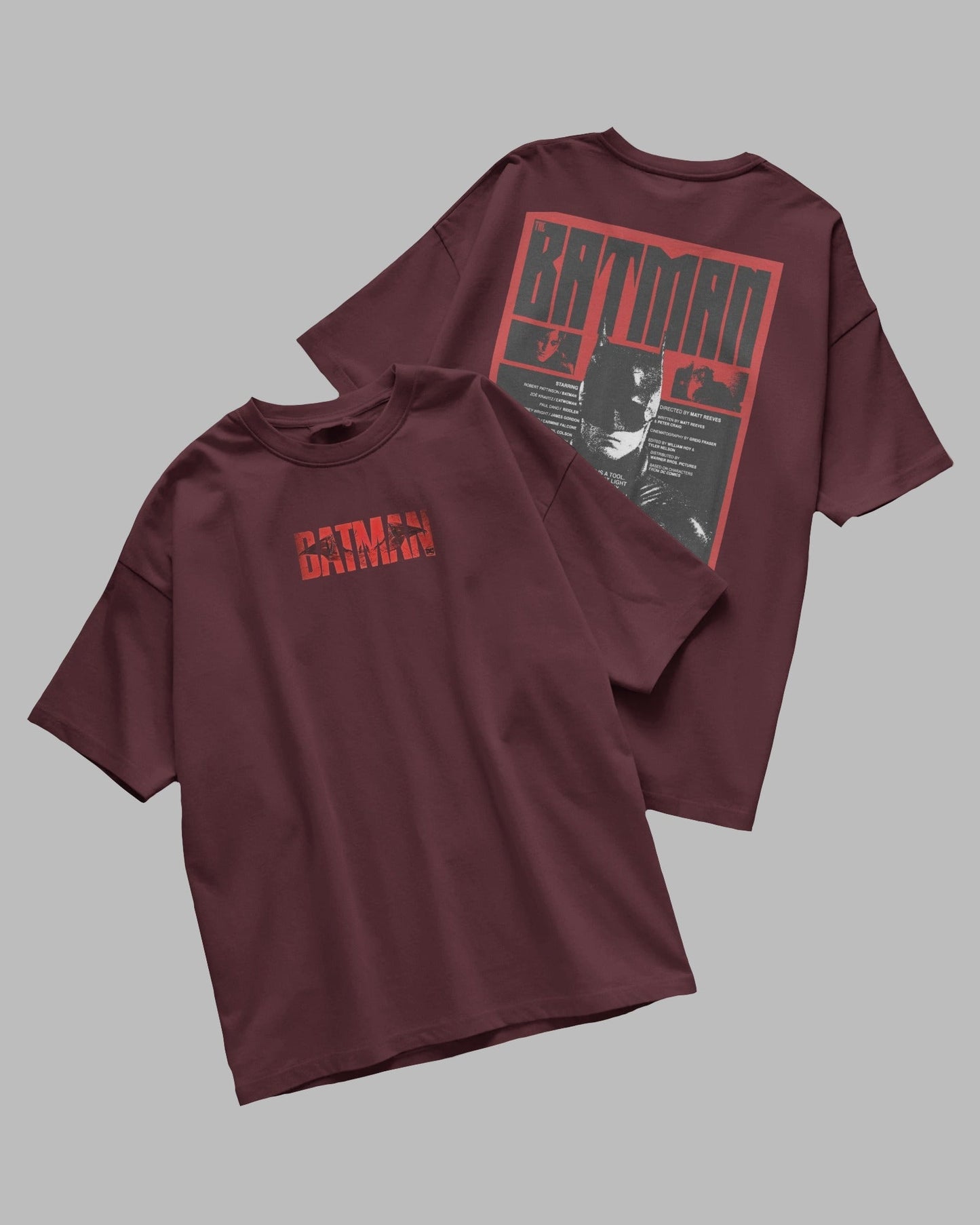 Maroon t-shirt with 'Batman' logo on a gray background