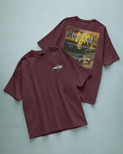 Colour_Maroon t-shirt with car graphic on front and back on a light blue background