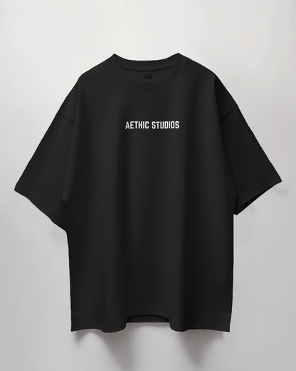 Black t-shirt with 'AETHIC STUDIOS' text on a light gray background