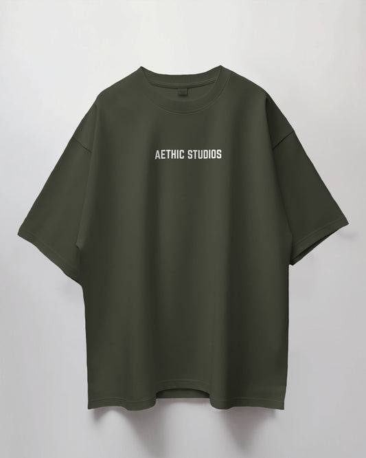 Green t-shirt with 'AETHIC STUDIOS' text on a white background