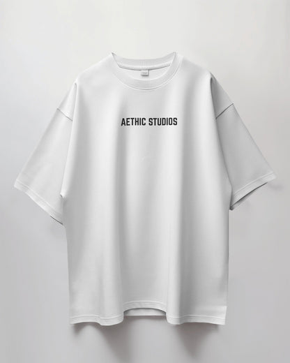 White oversized t-shirt with Ready Set Go graphic design on the back and Aethic Studios text on the front