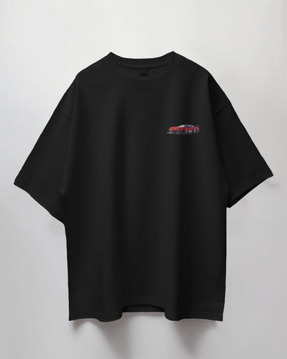 Colour_Black t-shirt with a small red graphic on a light gray background