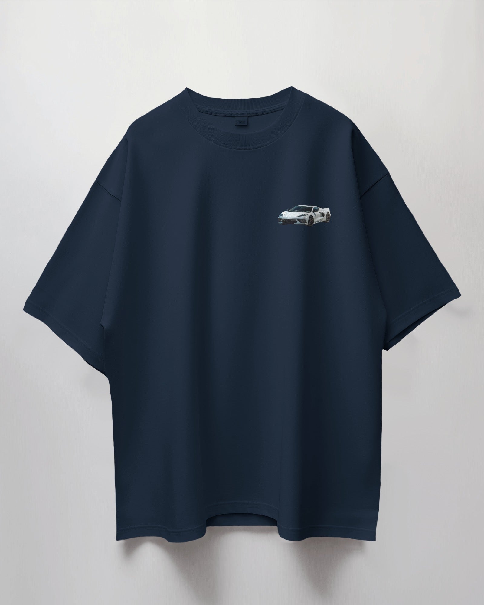 Colour_Navyblue t-shirt with a small white car graphic on a light gray background