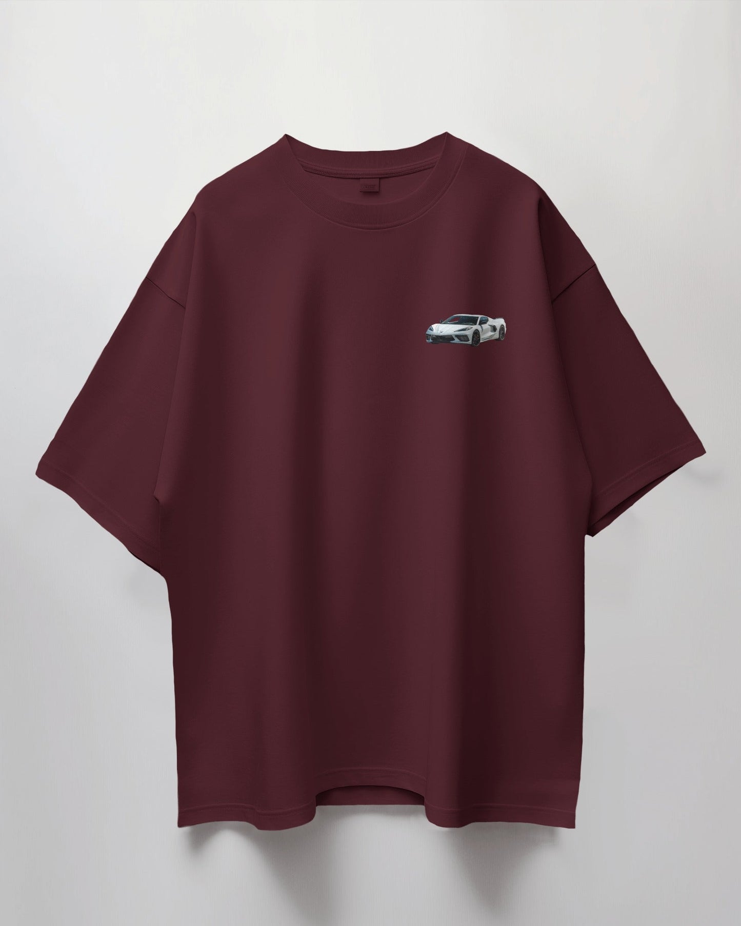 Colour_Maroon t-shirt with a small graphic on a light gray background