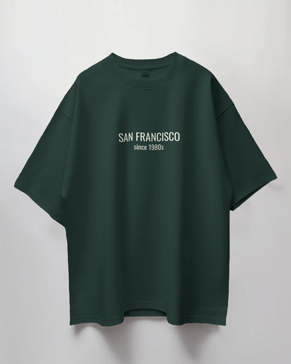 Green t-shirt with 'San Francisco since 1980s' text on a light gray background