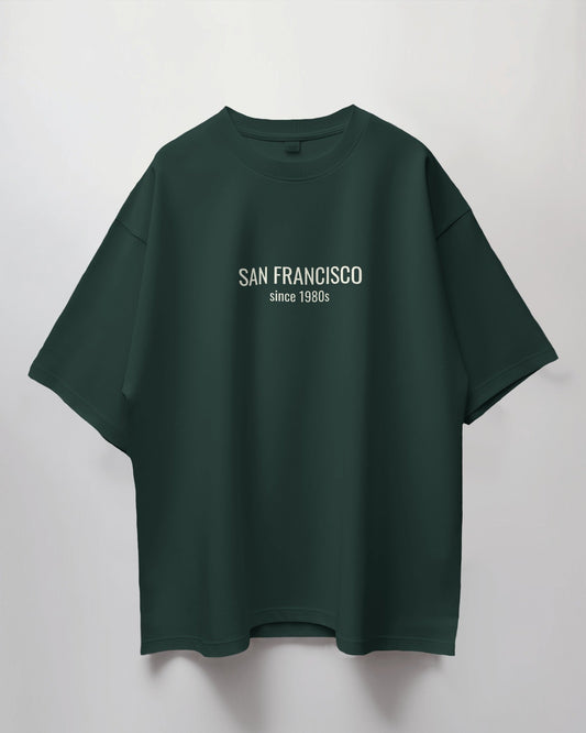 Green t-shirt with 'San Francisco since 1980s' text on a light gray background
