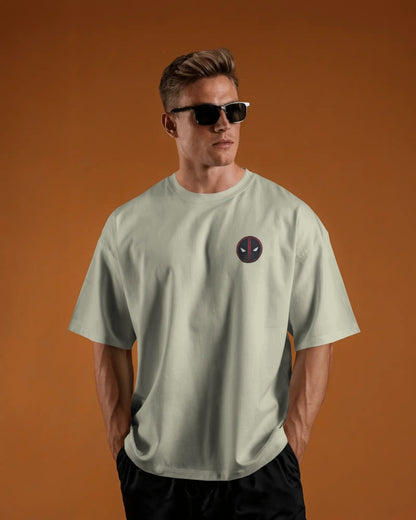 Man wearing a off white t-shirt with a logo of deadpool