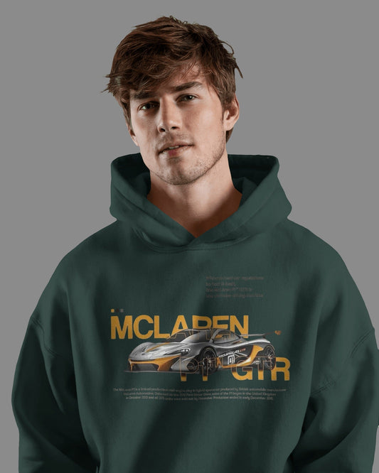 Person wearing a Colour_BottleGreen hoodie with McLaren logo on a gray background