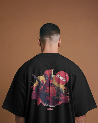 Person wearing a black t-shirt with a graphic of marvel character deadpool