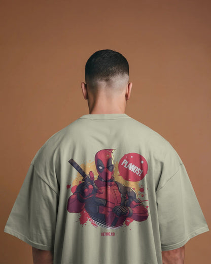 Person wearing a t-shirt with a Deadpool graphic on a offwhite tee