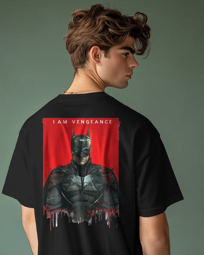 Person wearing a black t-shirt with a graphic design of a superhero and 'I AM VENGEANCE' text on the back.